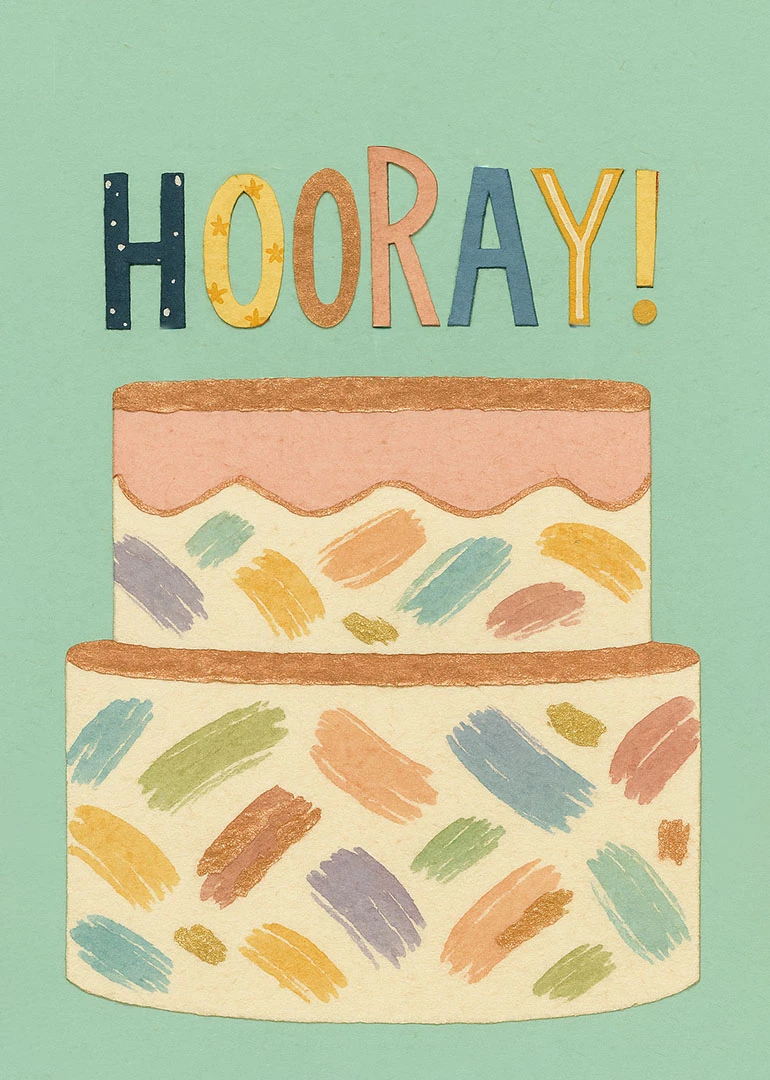 A pastel cake card with colorful Hooray lettering on a mint green background and texture.