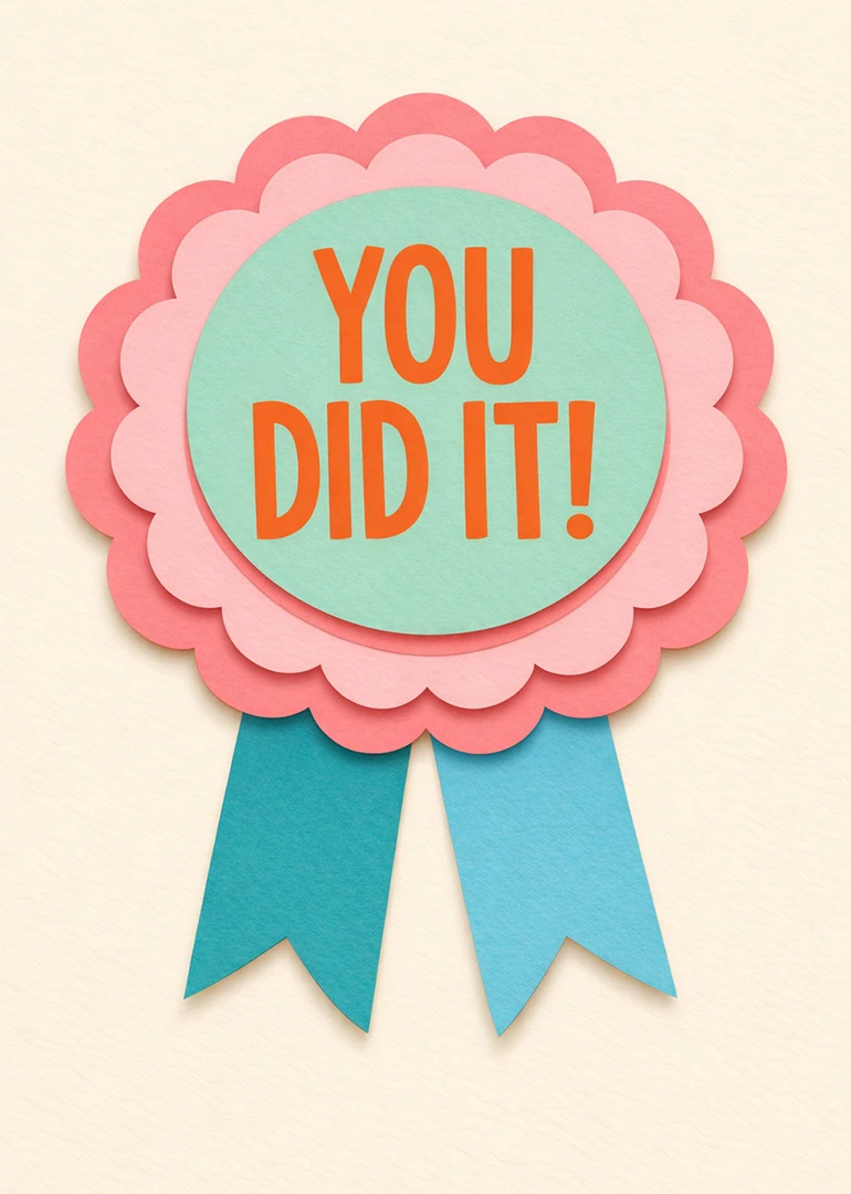 Pastel paper rosette card with You Did It text in orange and blue ribbons below.