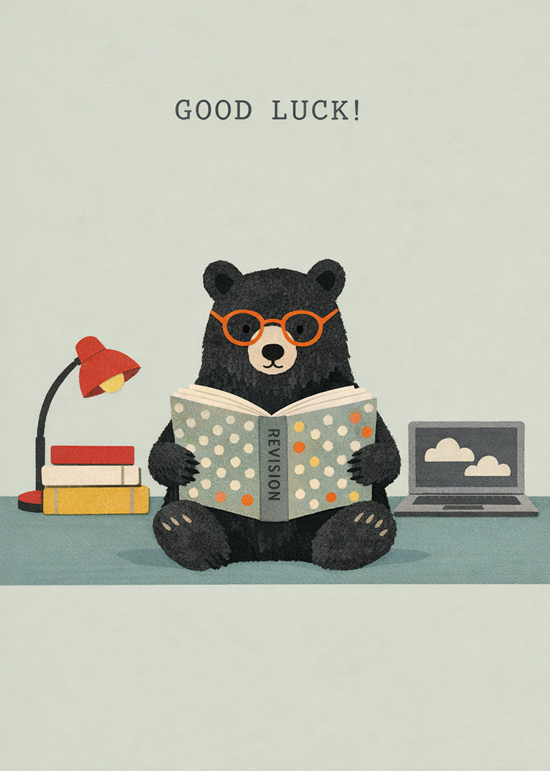 Bear with orange glasses reading revision book with good luck text