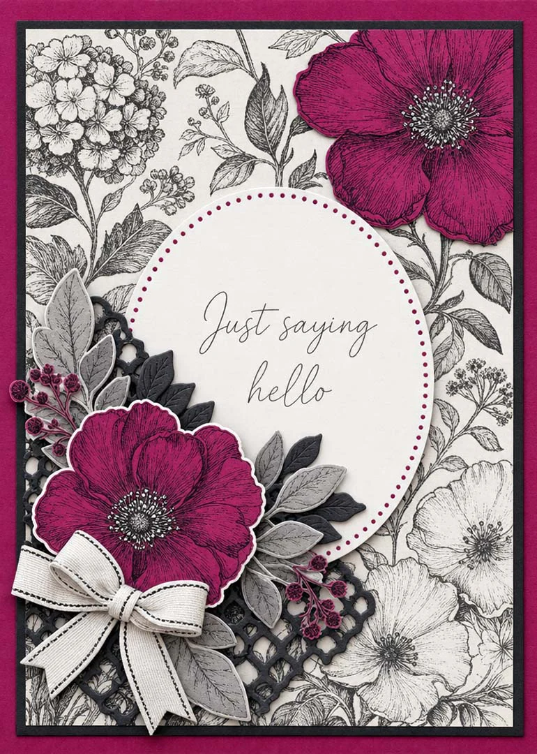 Layered magenta flowers frame a scripted Just saying hello message on a black botanical card.