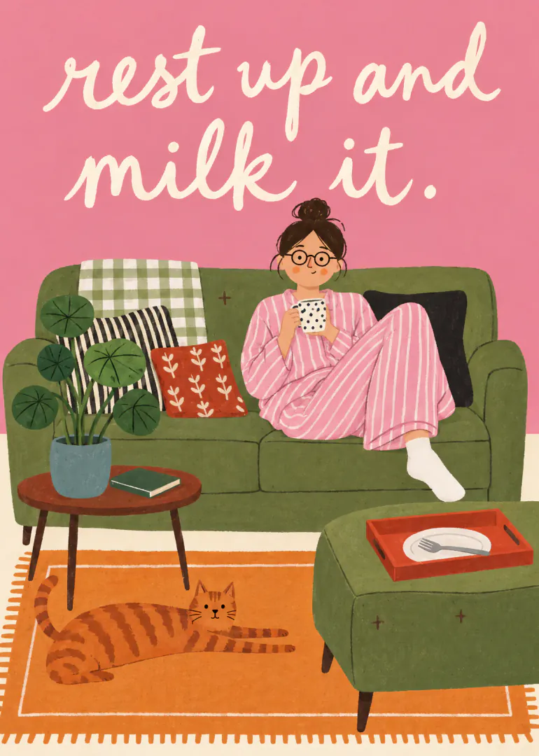 Illustrated woman in pink striped pyjamas drinking from a mug on a green sofa, with a ginger cat and the text “rest up and milk it.”
