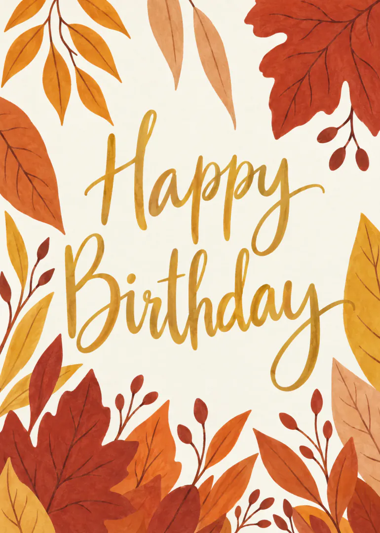 Cream birthday card with gold Happy Birthday lettering framed by illustrated autumn leaves.