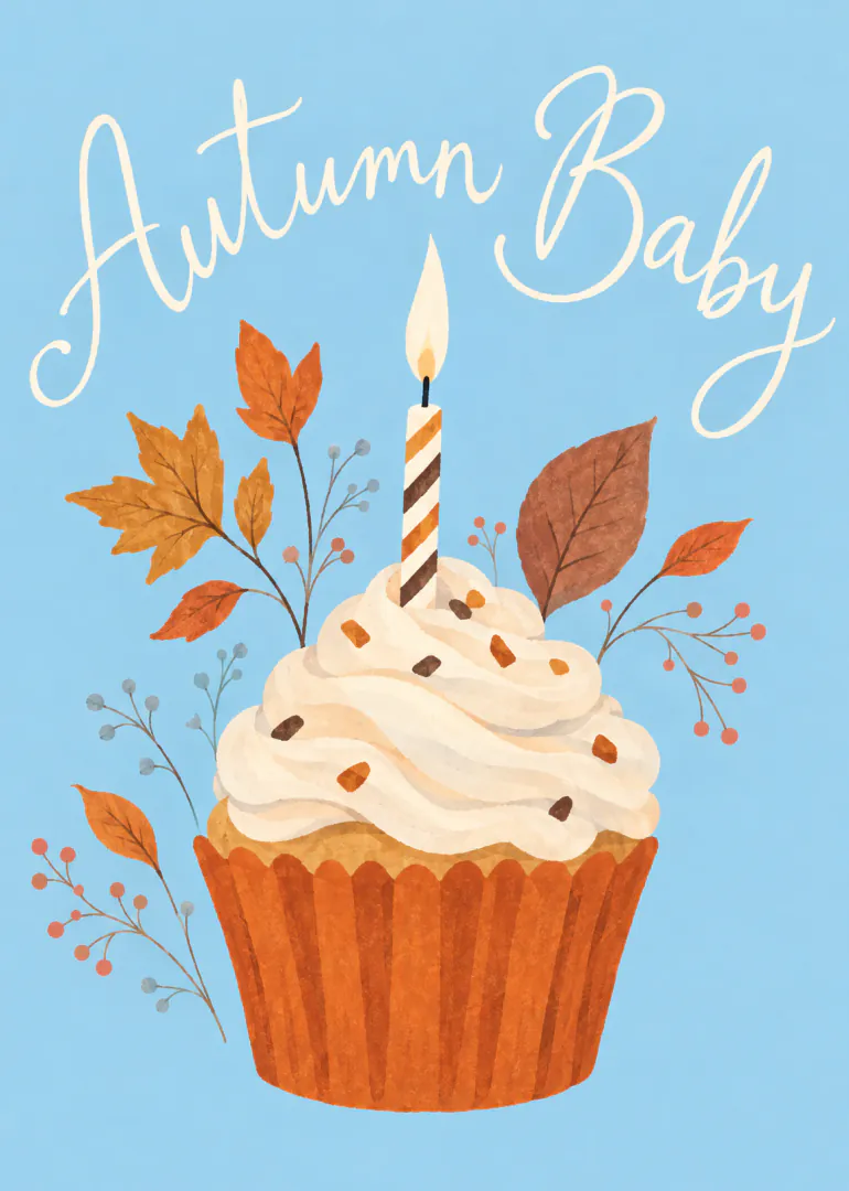 Blue card featuring an iced cupcake with a lit striped candle, autumn leaves and the words “Autumn Baby”.