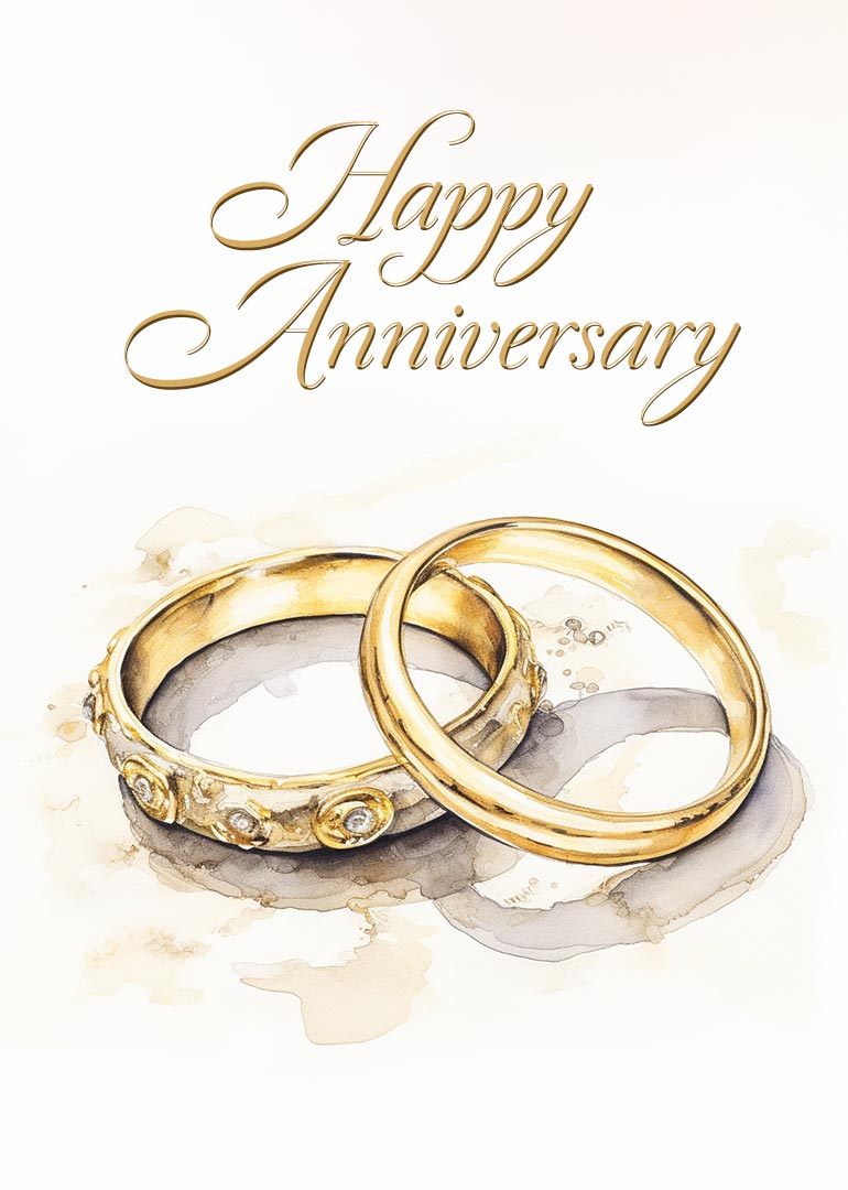 Two gold wedding rings with elegant happy anniversary text above