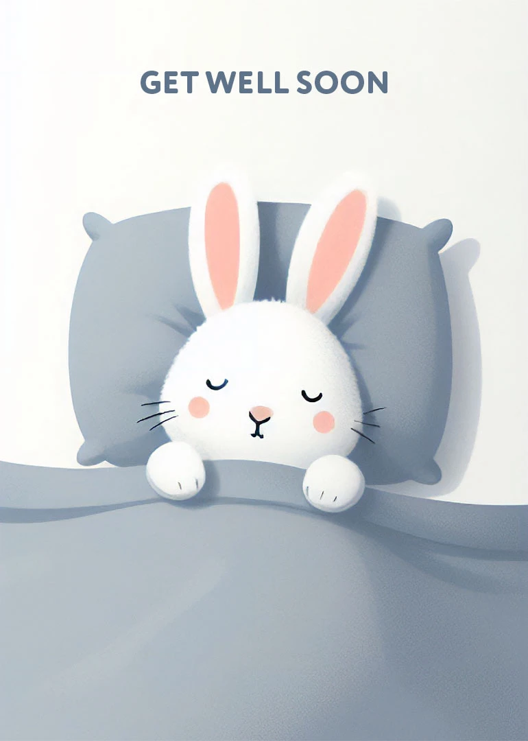 Cute bunny sleeping in bed under Get Well Soon text on a soft grey card.