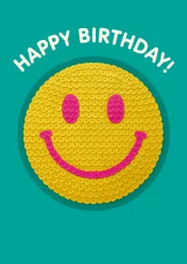 Yellow smiley face with pink features and Happy Birthday text on teal background card design.
