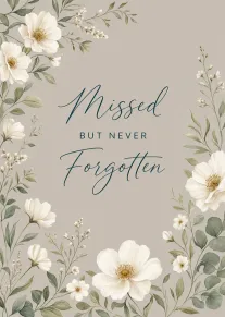 Soft floral border card reading Missed but Never Forgotten in elegant teal script for sympathy.