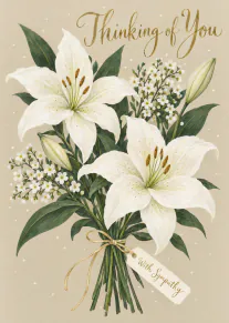 Elegant sympathy card showing a bouquet of white lilies and small white flowers with gold lettering.