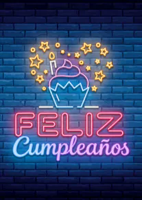 Tarjeta vertical con un cupcake, estrellas y el mensaje luminoso «FELIZ Cumpleaños» sobre una pared de ladrillos azul.