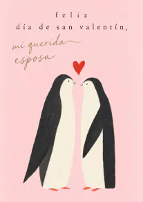 Tarjeta rosa con dos pingüinos frente a frente bajo un corazón rojo y un mensaje para una esposa.
