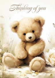 Soft teddy bear with flowers and thinking of you message