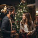 Couple talking at a Christmas party