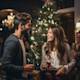 Couple talking at a Christmas party