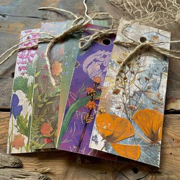Handcrafted bookmarks and gift tags made from old greeting cards, showcasing creativity and sustainability