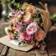 Warmly written congratulation card by fresh bouquet, anticipating happy moments ahead